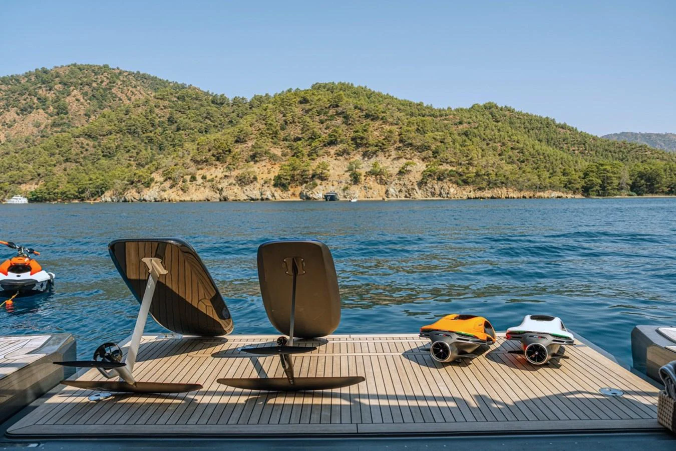The yacht's swim platform is equipped with water toys, offering a perfect spot for aquatic adventures. aboard RAISA Yacht for Sale