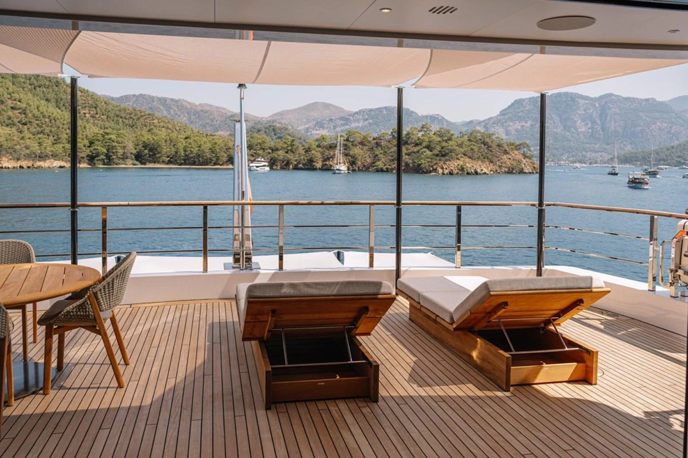 The sundeck offers a relaxing space with lounge chairs and stunning views of the surrounding waters. aboard RAISA Yacht for Sale