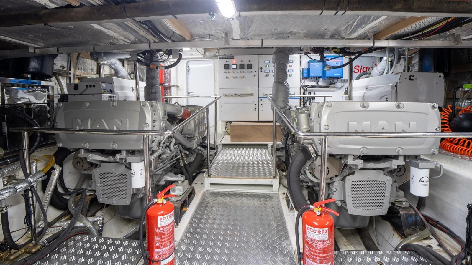 The engine room showcases powerful machinery and well-organized systems. aboard TROYWIZARD Yacht for Sale
