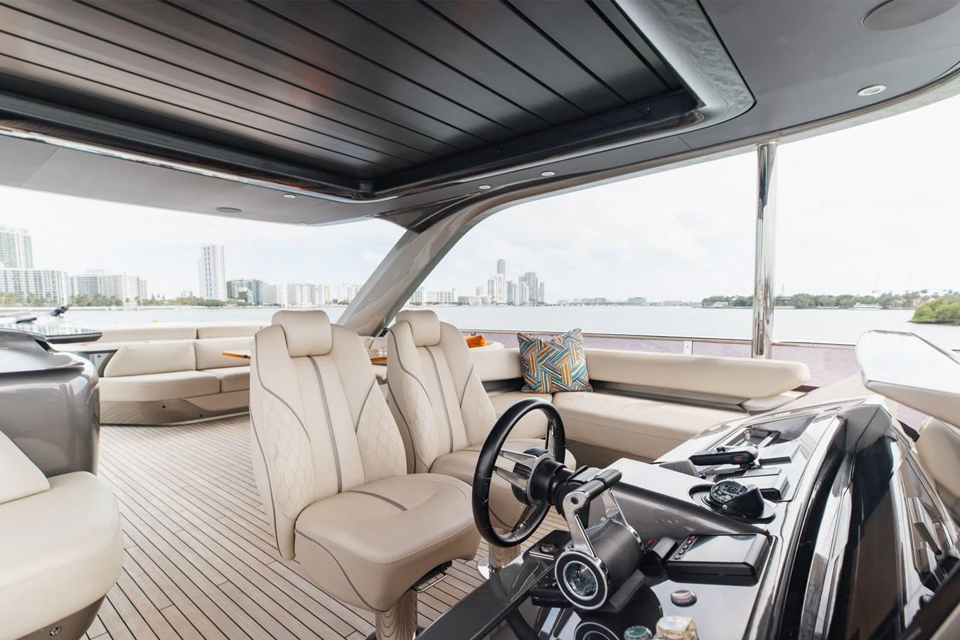 The helm area features luxurious seating and state-of-the-art controls, with a panoramic view of the surrounding waters. aboard TOMORROW NEVER KNOWS Yacht for Sale