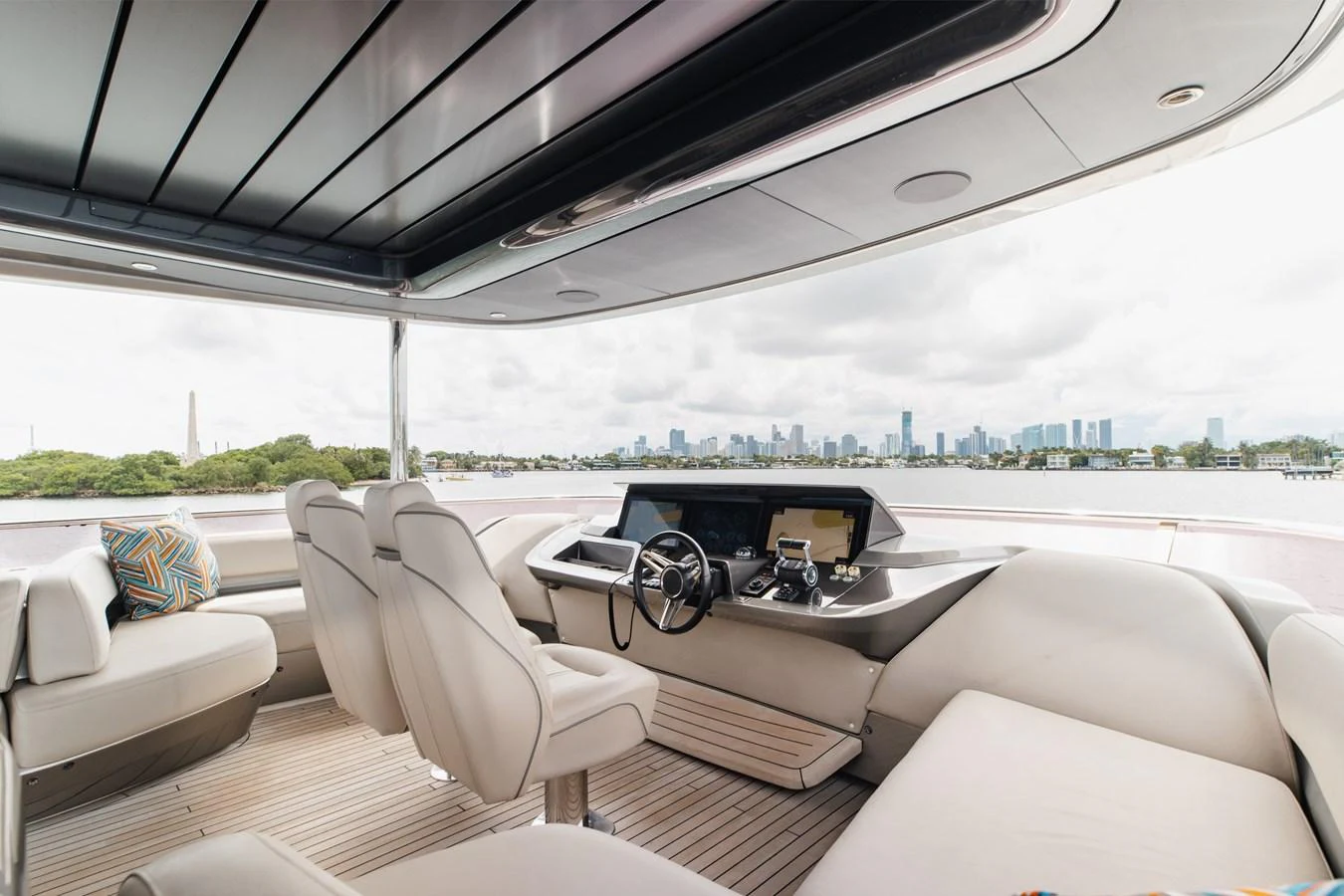 The helm area offers a sleek and modern design with comfortable seating and panoramic views. aboard TOMORROW NEVER KNOWS Yacht for Sale