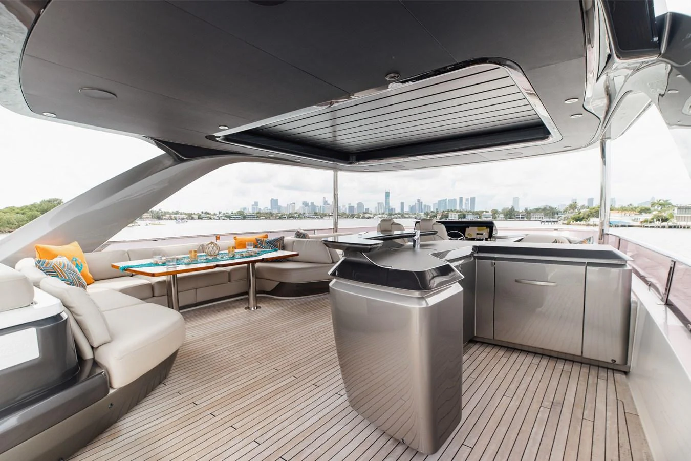The flybridge offers a spacious and stylish outdoor area with comfortable seating and a well-equipped bar. aboard TOMORROW NEVER KNOWS Yacht for Sale
