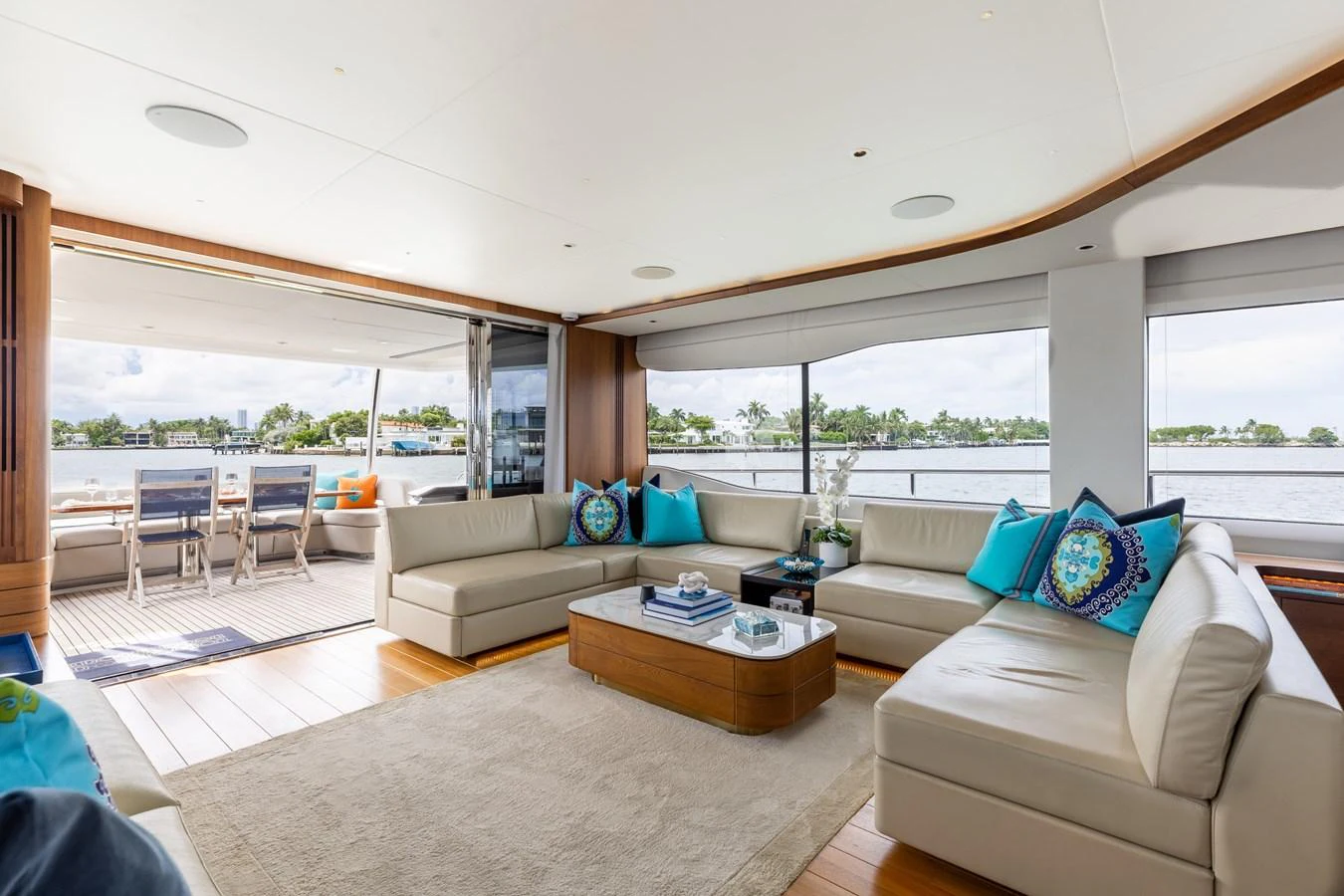 The salon offers a spacious and inviting area with plush seating and panoramic views. aboard TOMORROW NEVER KNOWS Yacht for Sale