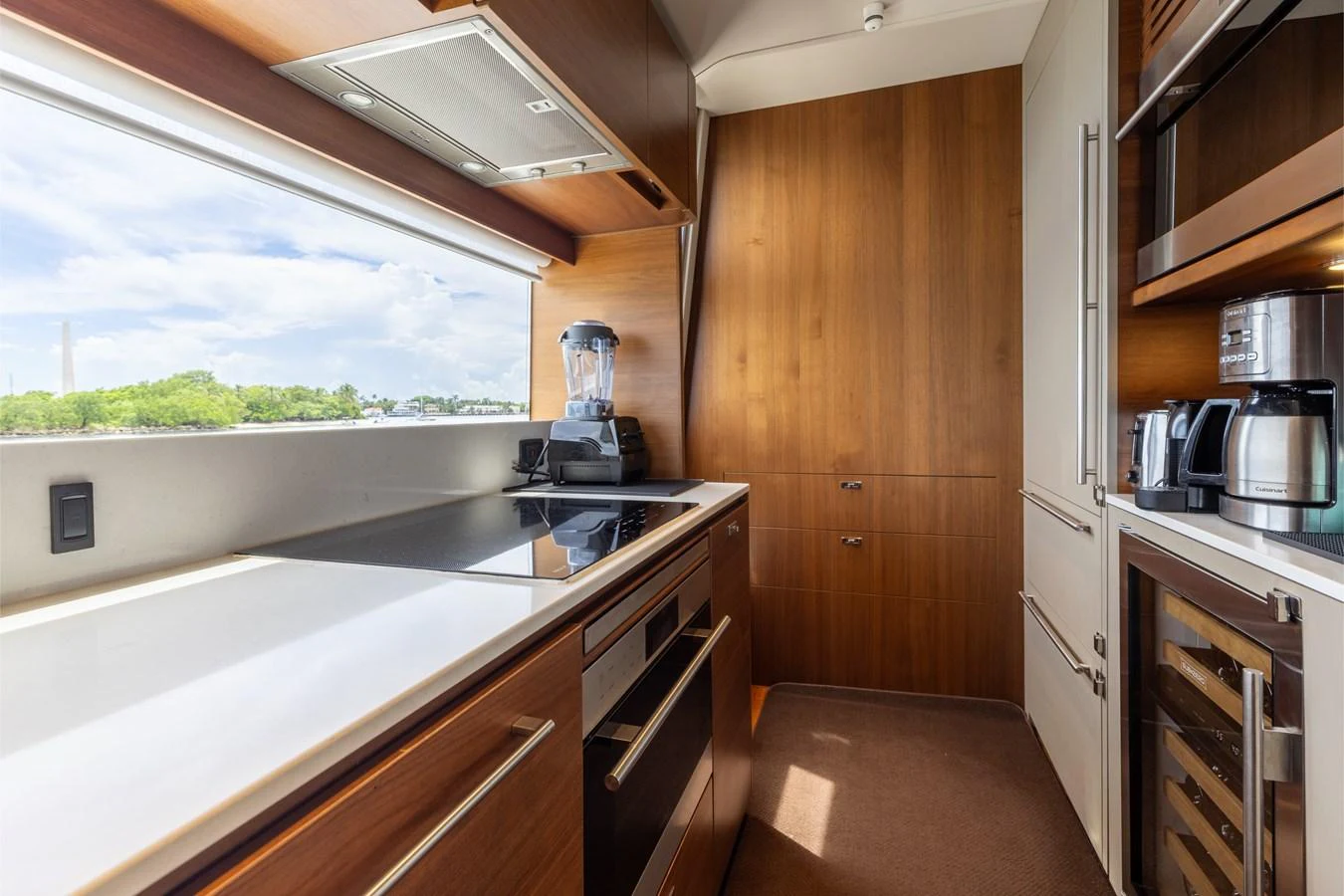 The yacht's galley is equipped with modern appliances and features a sleek, contemporary design. aboard TOMORROW NEVER KNOWS Yacht for Sale
