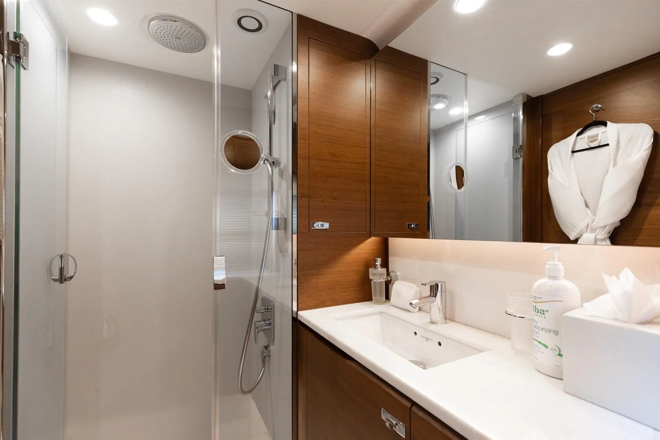 The bathroom features modern fixtures and a sleek design with ample storage space. aboard TOMORROW NEVER KNOWS Yacht for Sale