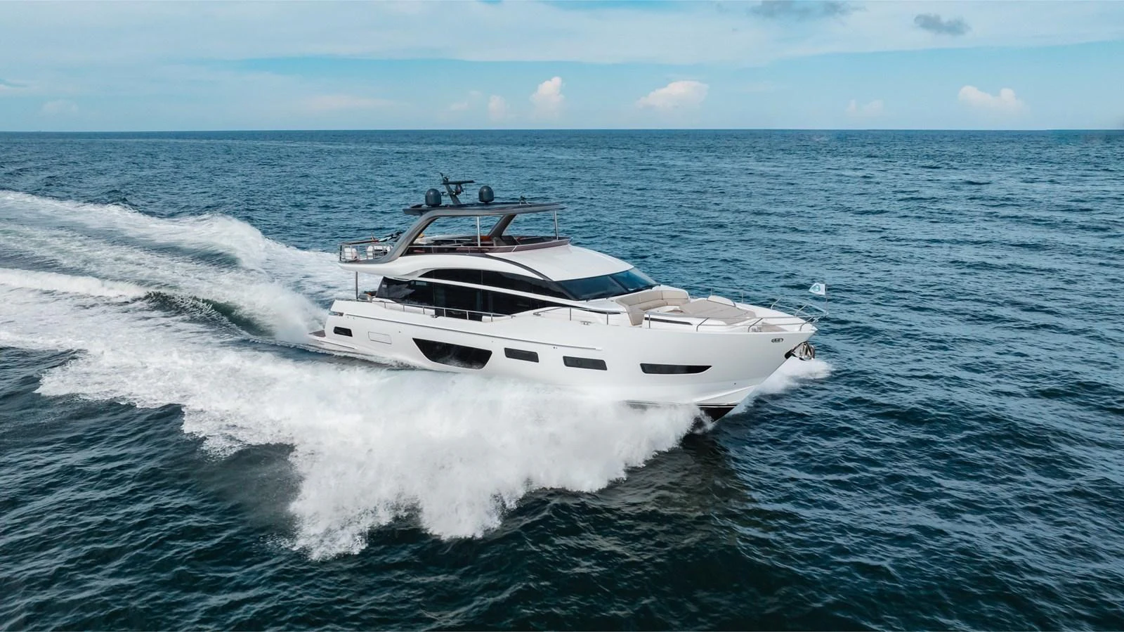 A sleek and modern yacht cruises swiftly through the open sea, showcasing its elegant design and powerful performance. aboard TOMORROW NEVER KNOWS Yacht for Sale