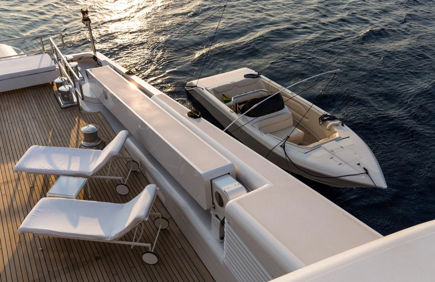 A sleek tender is moored alongside the yacht, ready for excursions. aboard ZEUS Yacht for Sale