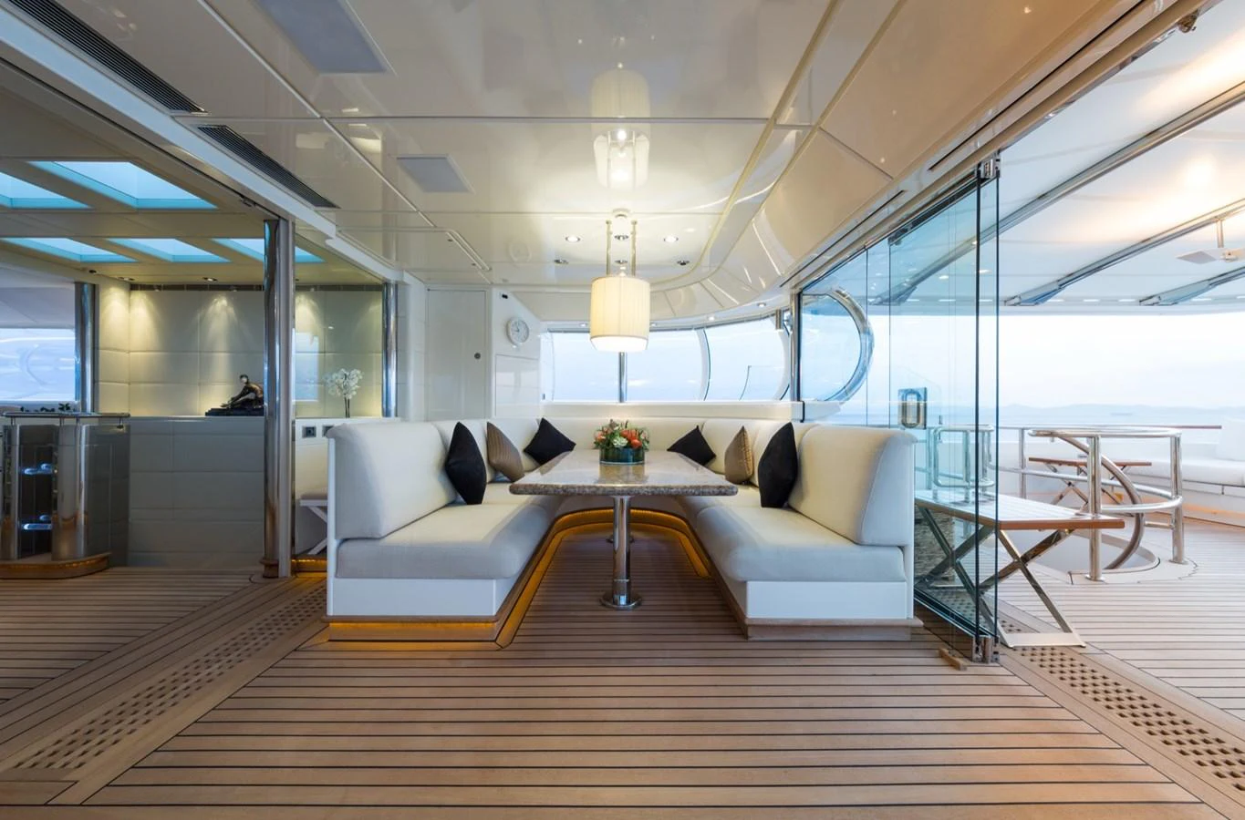 The yacht's dining area features elegant seating and a stylish table, perfect for enjoying meals with a view. aboard ZEUS Yacht for Sale