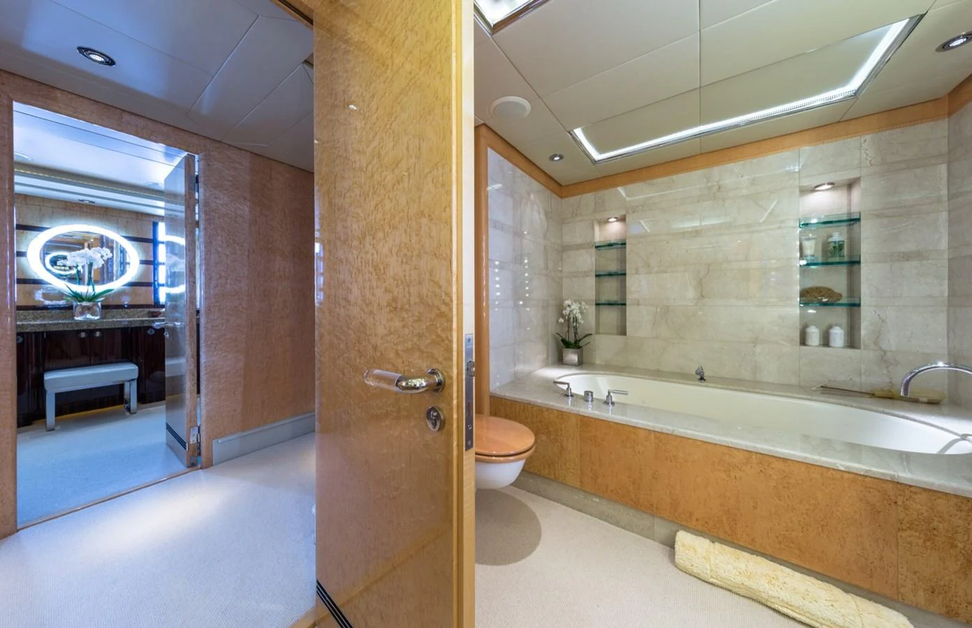A luxurious bathroom featuring a spacious bathtub and elegant decor. aboard ZEUS Yacht for Sale