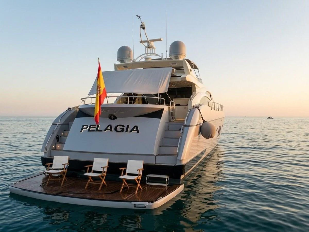 The yacht's aft deck features a spacious swim platform with lounge chairs, perfect for relaxing by the water. aboard PELAGIA Yacht for Sale