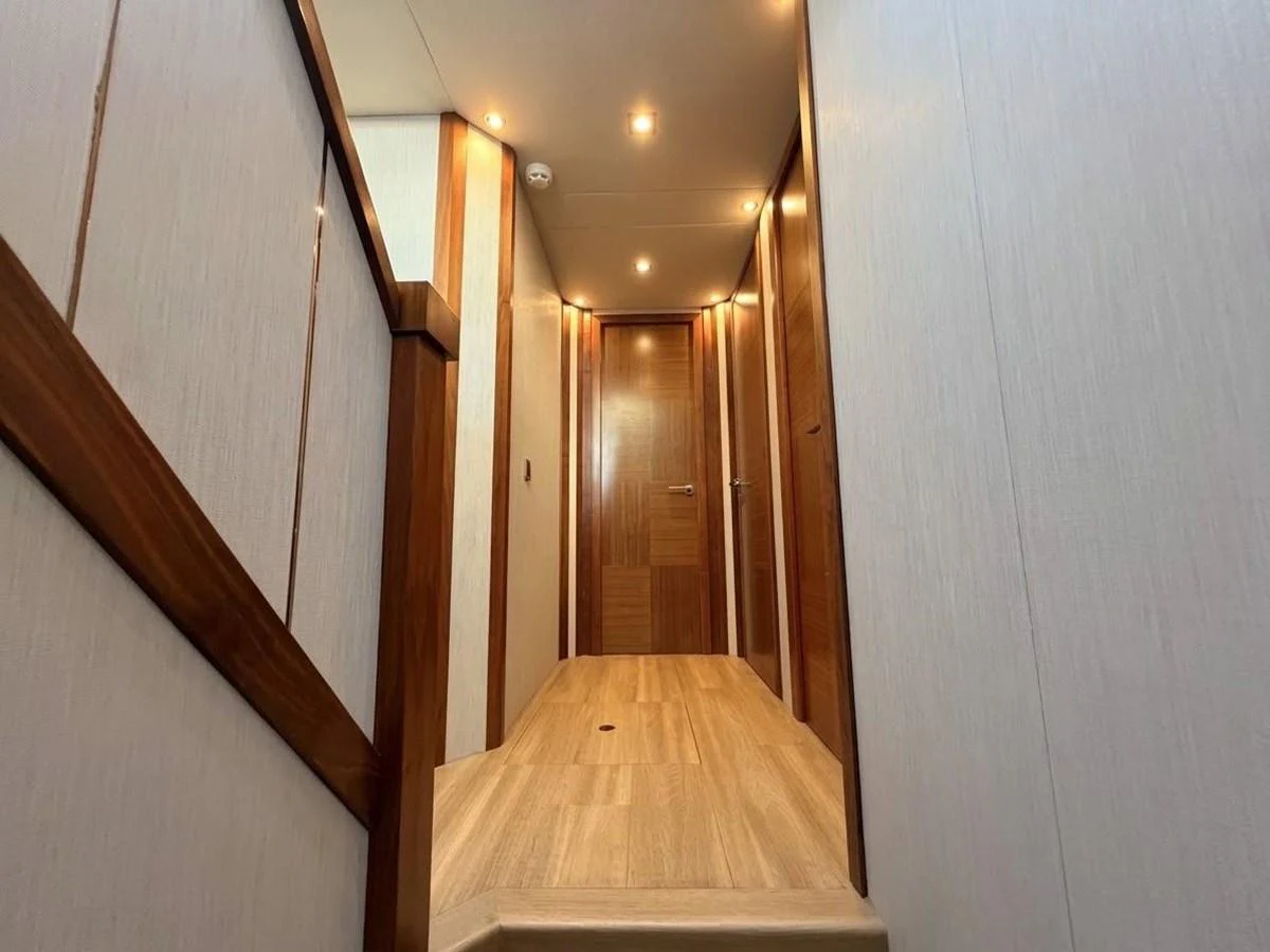 A well-lit hallway with wooden accents and modern design. aboard PELAGIA Yacht for Sale