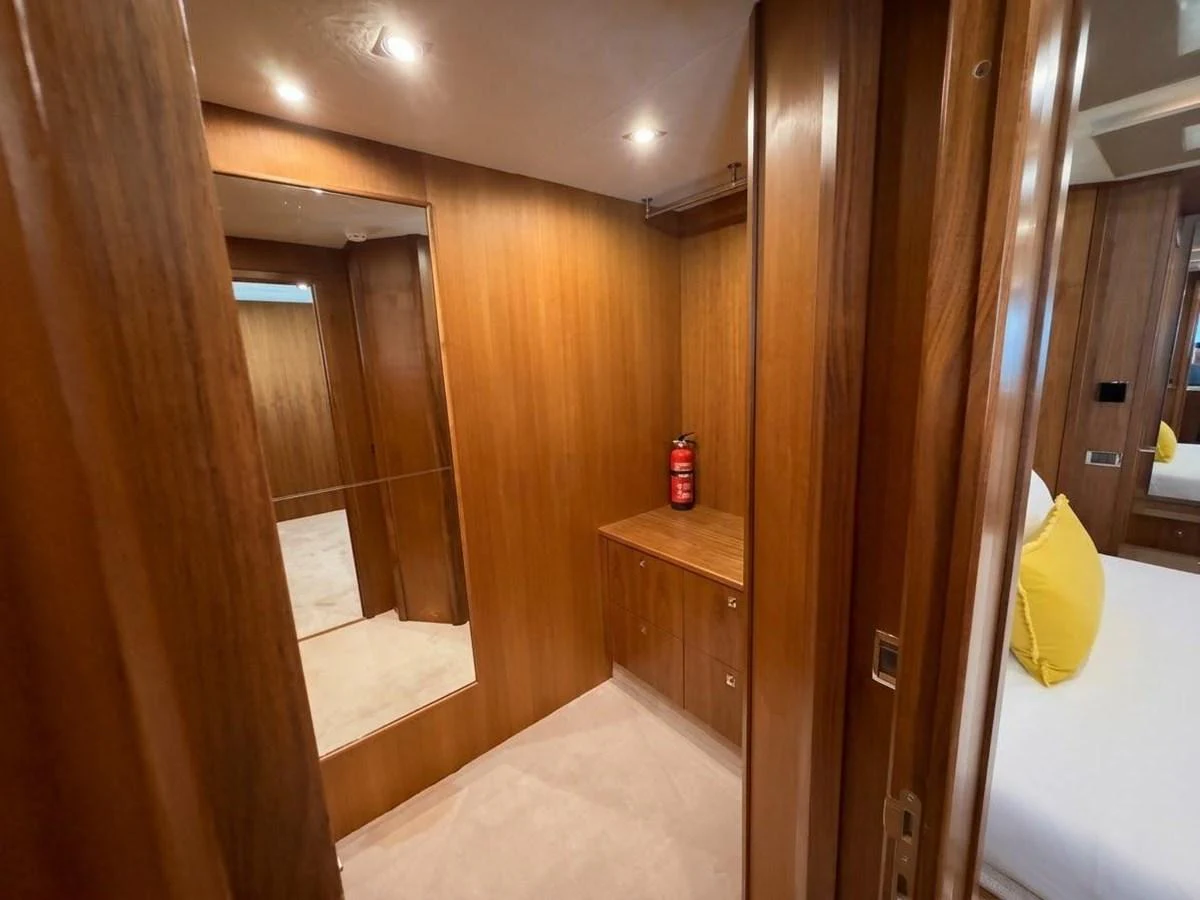 The yacht's interior features warm wooden paneling and a cozy, inviting atmosphere. aboard PELAGIA Yacht for Sale