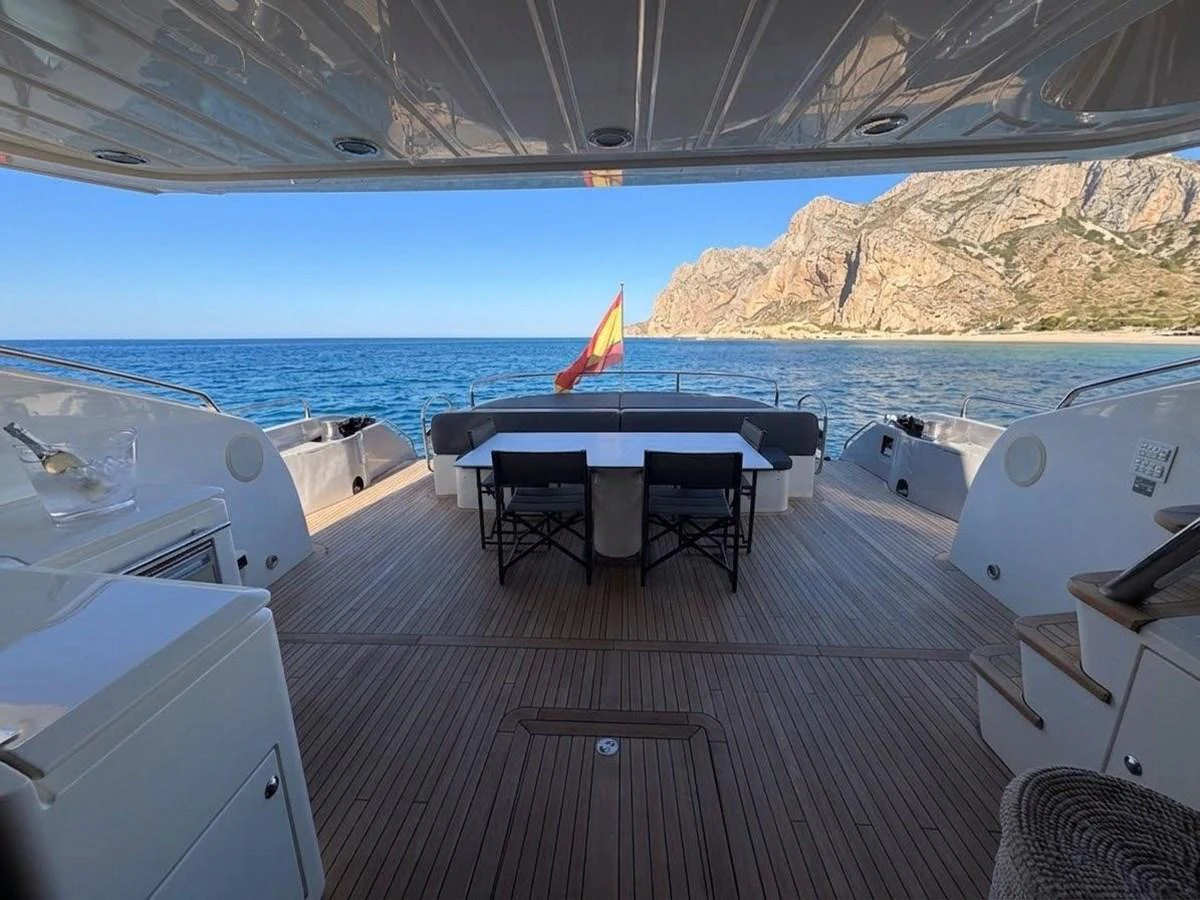 The aft deck offers a spacious and inviting area for alfresco dining with stunning views of the coastline. aboard PELAGIA Yacht for Sale