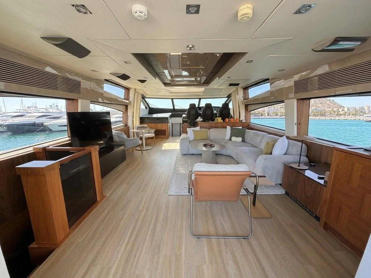 The salon features a spacious and modern design with ample seating and large windows offering stunning views. aboard PELAGIA Yacht for Sale