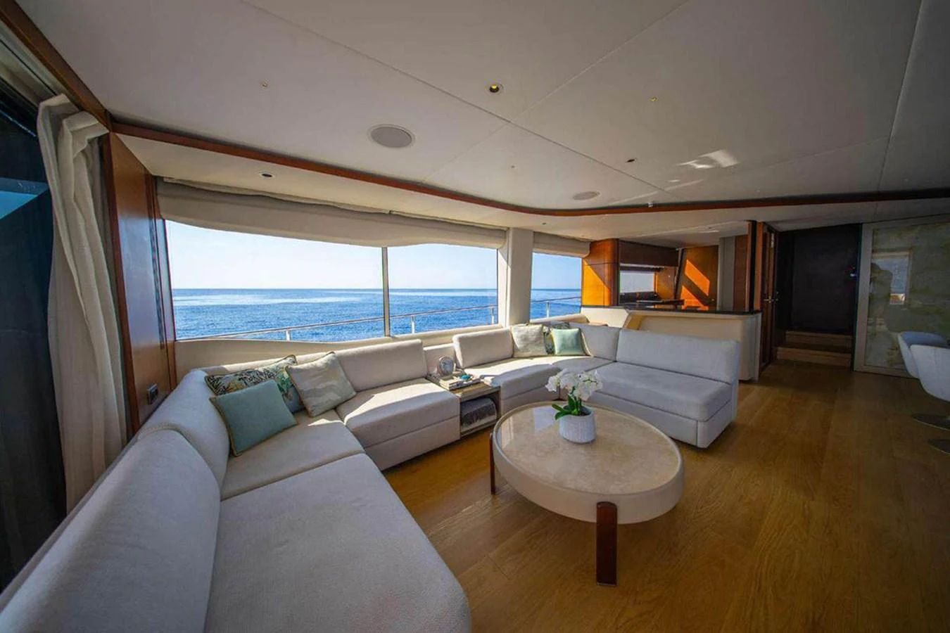 The salon offers a spacious and luxurious seating area with panoramic ocean views. aboard AHAVA IV Yacht for Sale