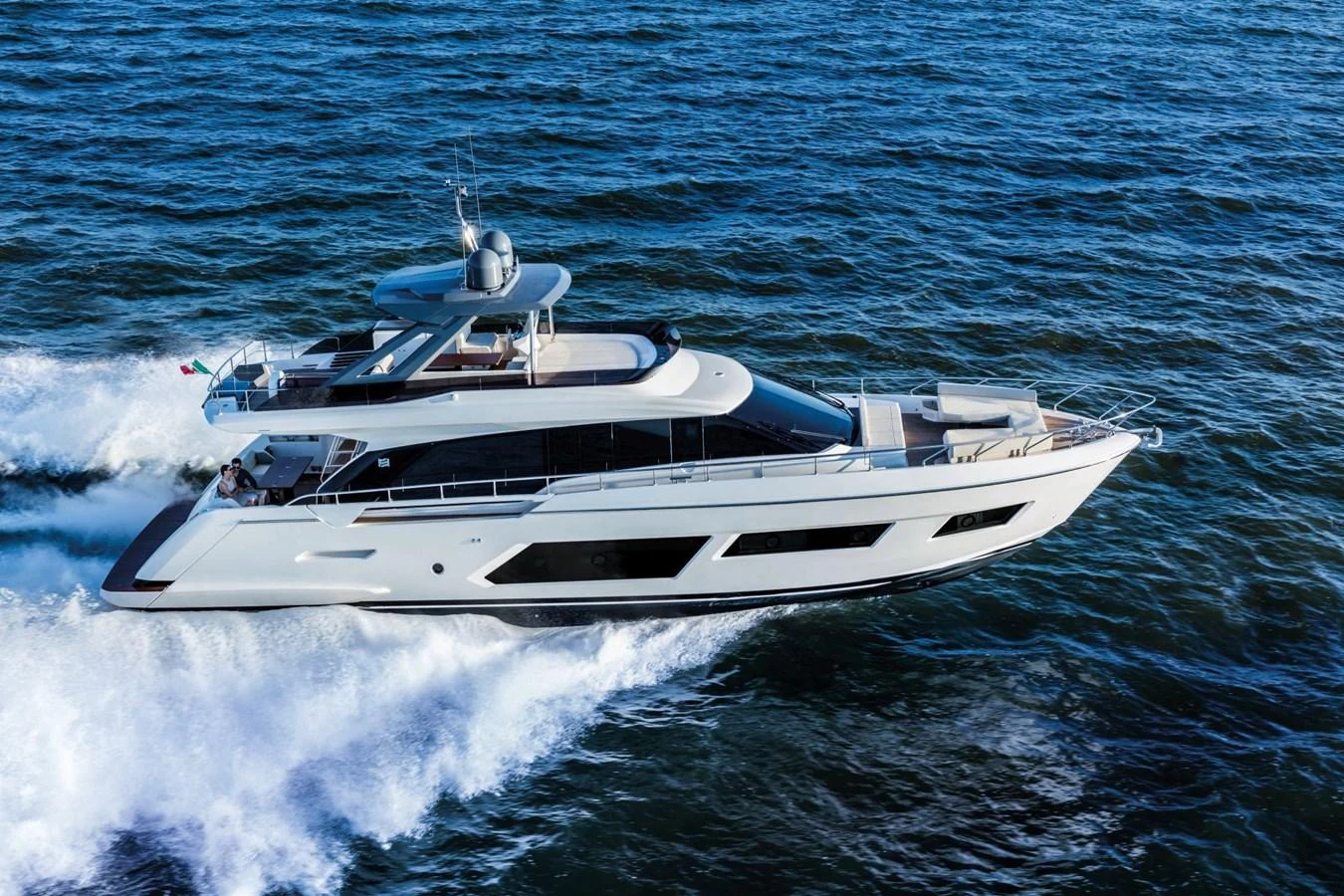 A sleek and modern yacht cruises swiftly through the open water. aboard LIVI B Yacht for Sale
