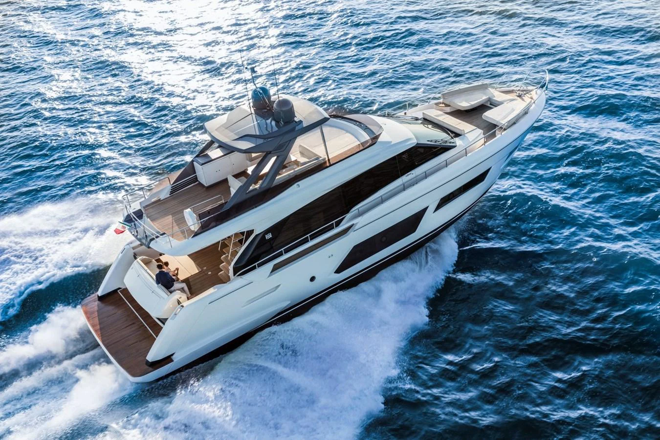 A sleek and modern yacht cruises swiftly through the open water, showcasing its elegant design and spacious decks. aboard LIVI B Yacht for Sale