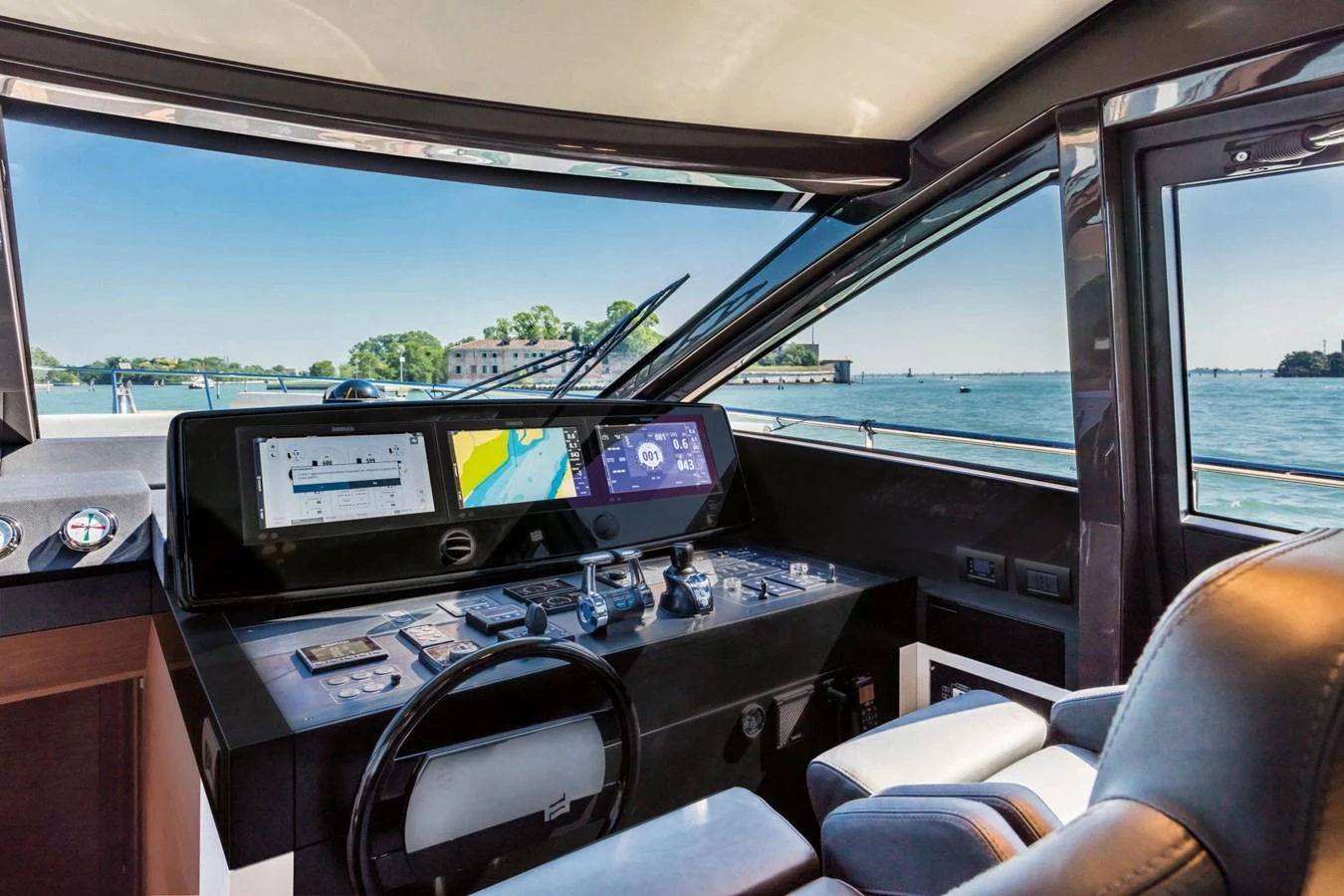 The helm station offers a commanding view with state-of-the-art navigation equipment and luxurious seating. aboard LIVI B Yacht for Sale