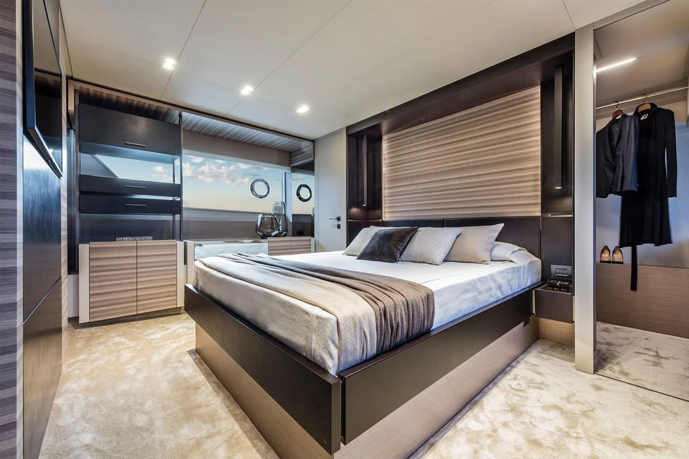 The master stateroom features a luxurious bed with modern decor and ample natural light. aboard LIVI B Yacht for Sale