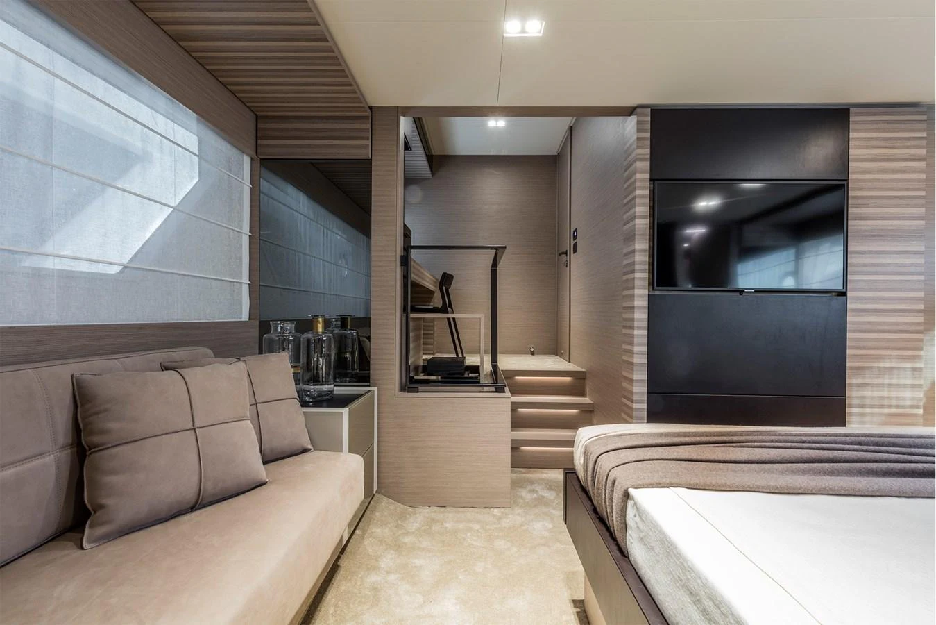A modern and stylish interior space featuring a comfortable seating area and a large flat-screen TV. aboard LIVI B Yacht for Sale