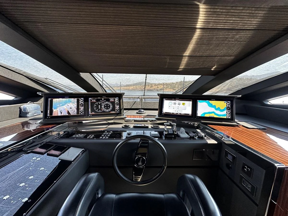 The helm station features advanced navigation systems and luxurious finishes. aboard 4SEAS Yacht for Sale