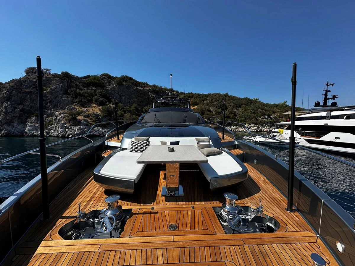 The yacht's foredeck features a luxurious lounging area with plush seating and a central table, perfect for relaxation. aboard 4SEAS Yacht for Sale