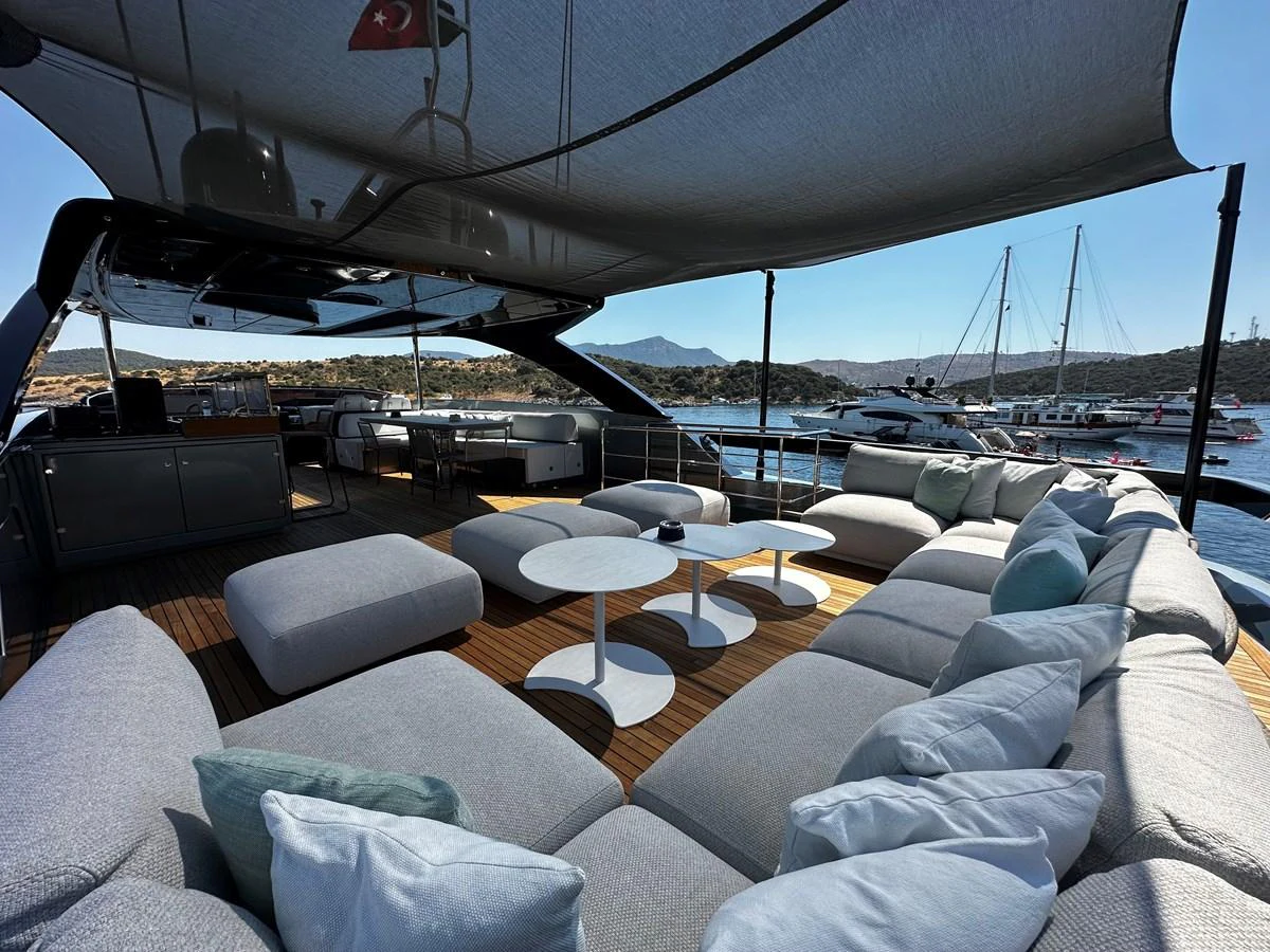 The sundeck offers a luxurious lounging area with ample seating and shade, perfect for relaxation. aboard 4SEAS Yacht for Sale