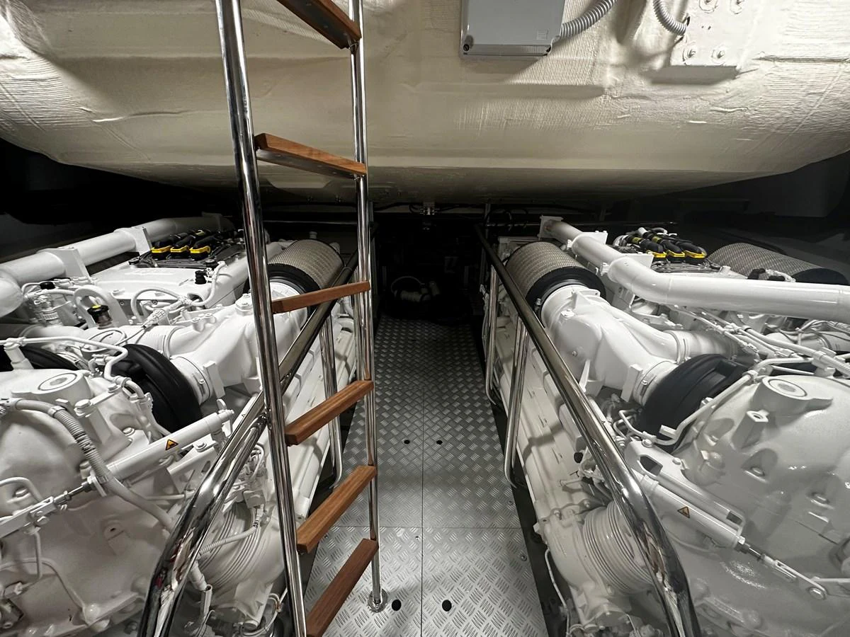 The engine room showcases powerful twin engines with a clean and organized layout. aboard 4SEAS Yacht for Sale
