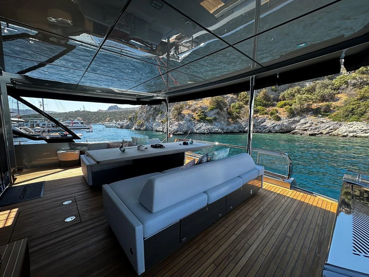 The aft deck offers a luxurious seating area with a stunning view of the surrounding waters. aboard 4SEAS Yacht for Sale
