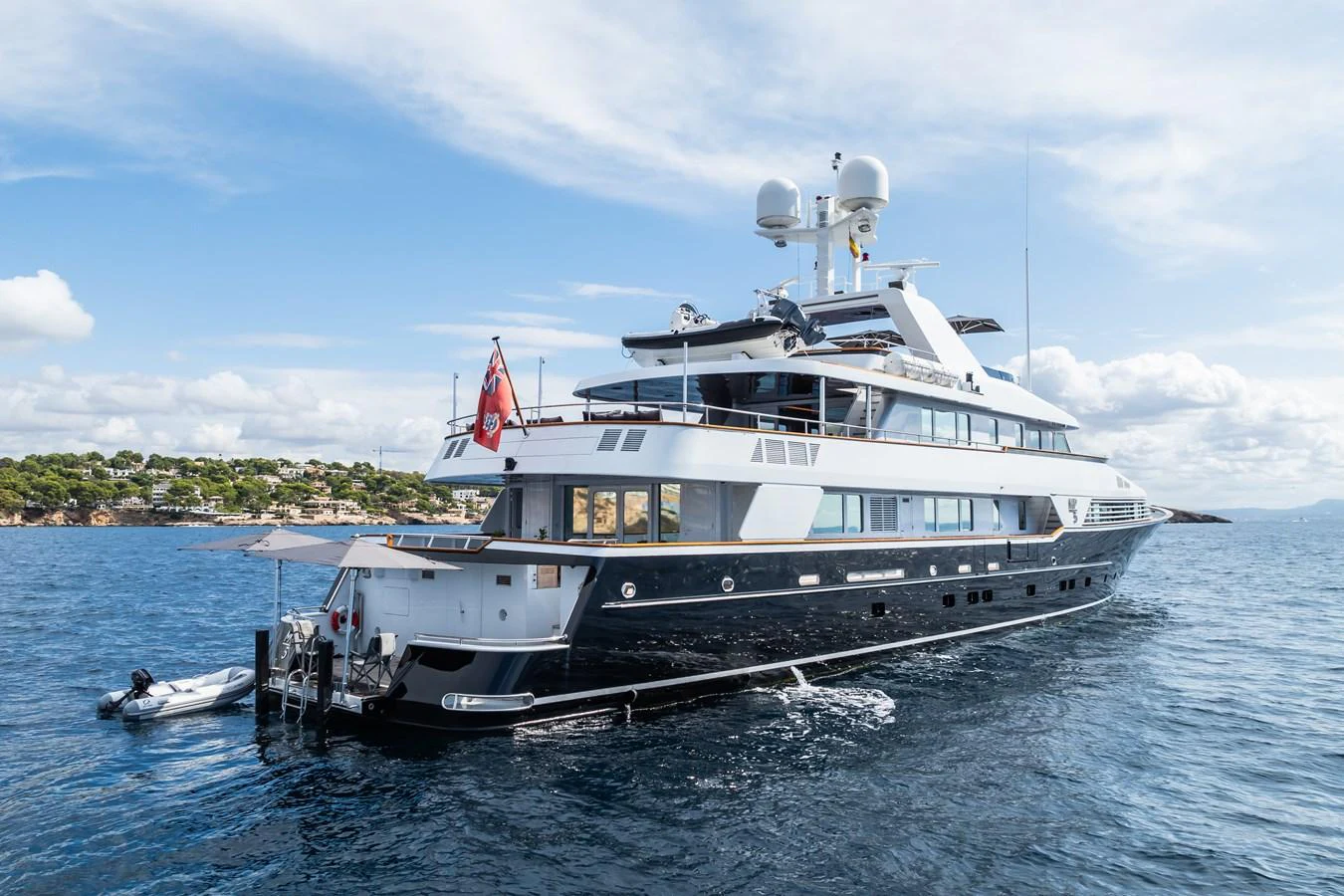 A luxurious yacht is anchored in serene waters, showcasing its elegant design and spacious decks. aboard MP5 Yacht for Sale