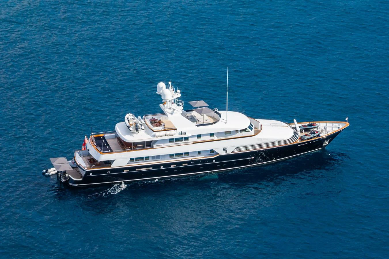 A luxurious yacht cruising on the open sea, showcasing its elegant design and spacious decks. aboard MP5 Yacht for Sale