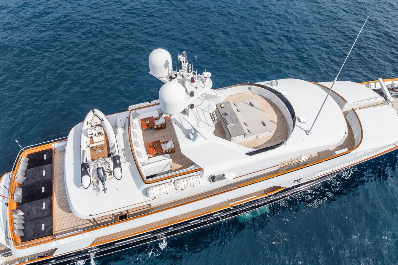 A luxurious yacht cruising on the open sea, showcasing its sleek design and spacious deck areas. aboard MP5 Yacht for Sale