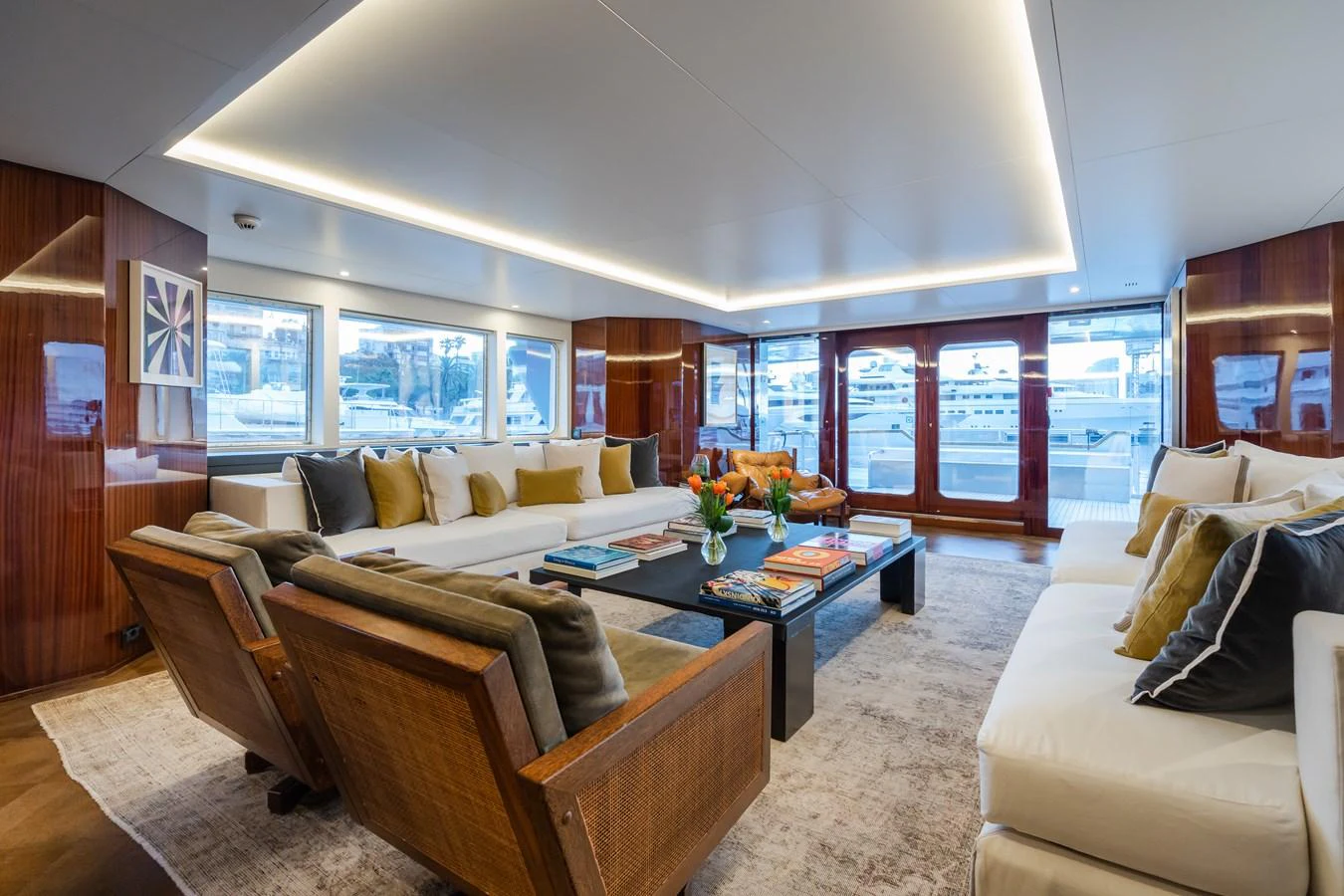 The salon offers a spacious and luxurious seating area with ample natural light and elegant decor. aboard MP5 Yacht for Sale