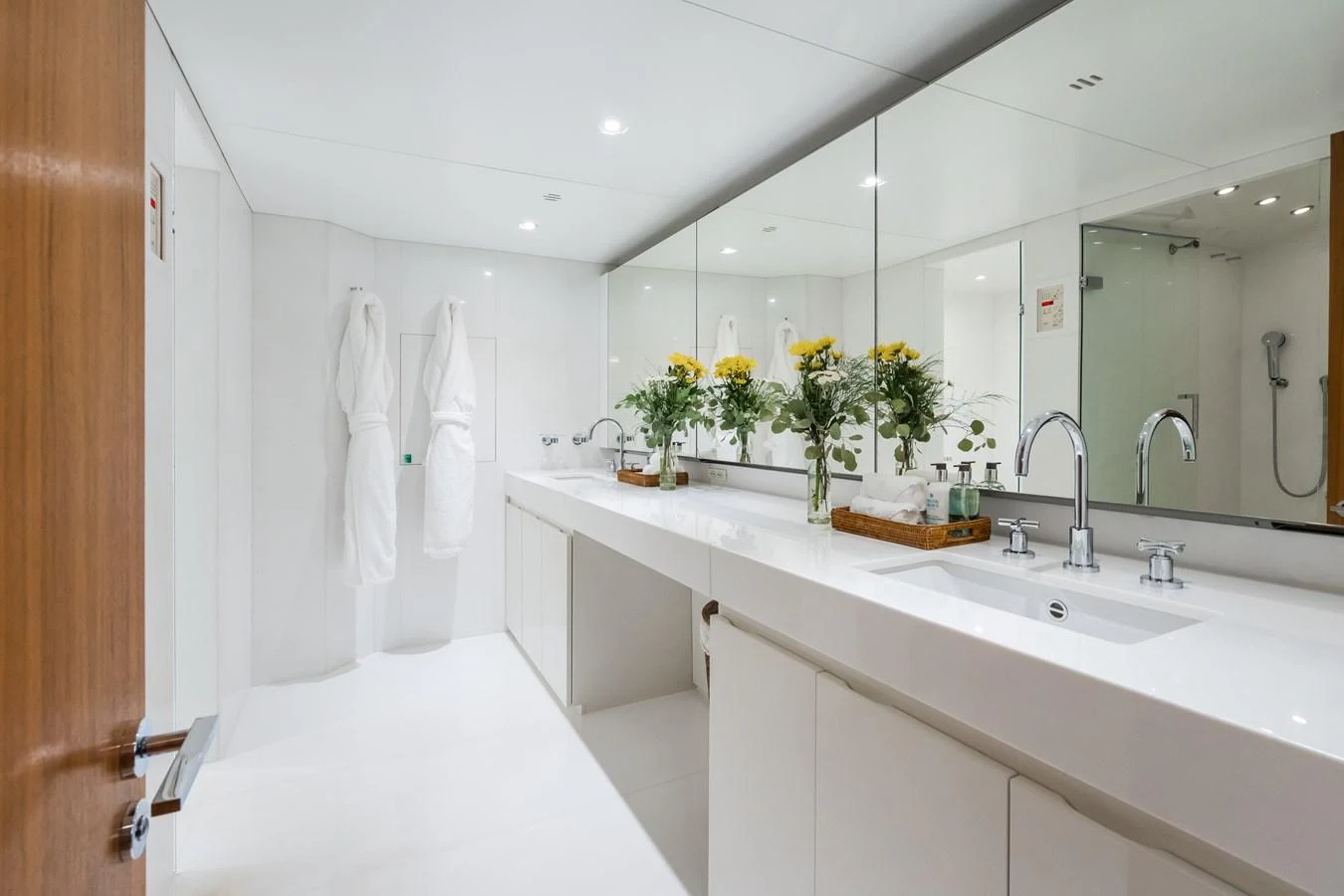 The yacht's bathroom features a sleek, modern design with ample counter space and elegant fixtures. aboard MP5 Yacht for Sale