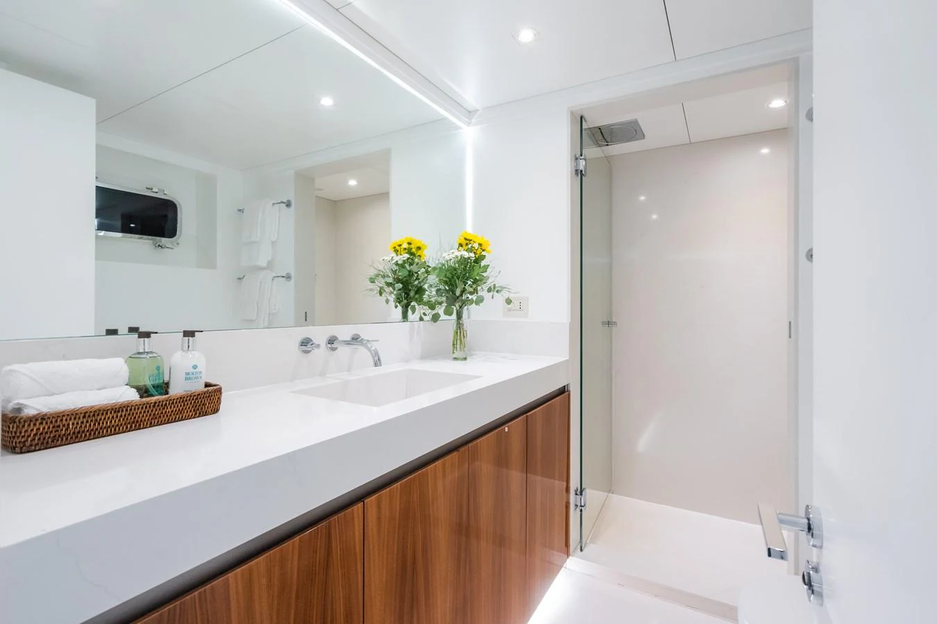 A modern yacht bathroom featuring sleek fixtures and a clean, minimalist design. aboard MP5 Yacht for Sale