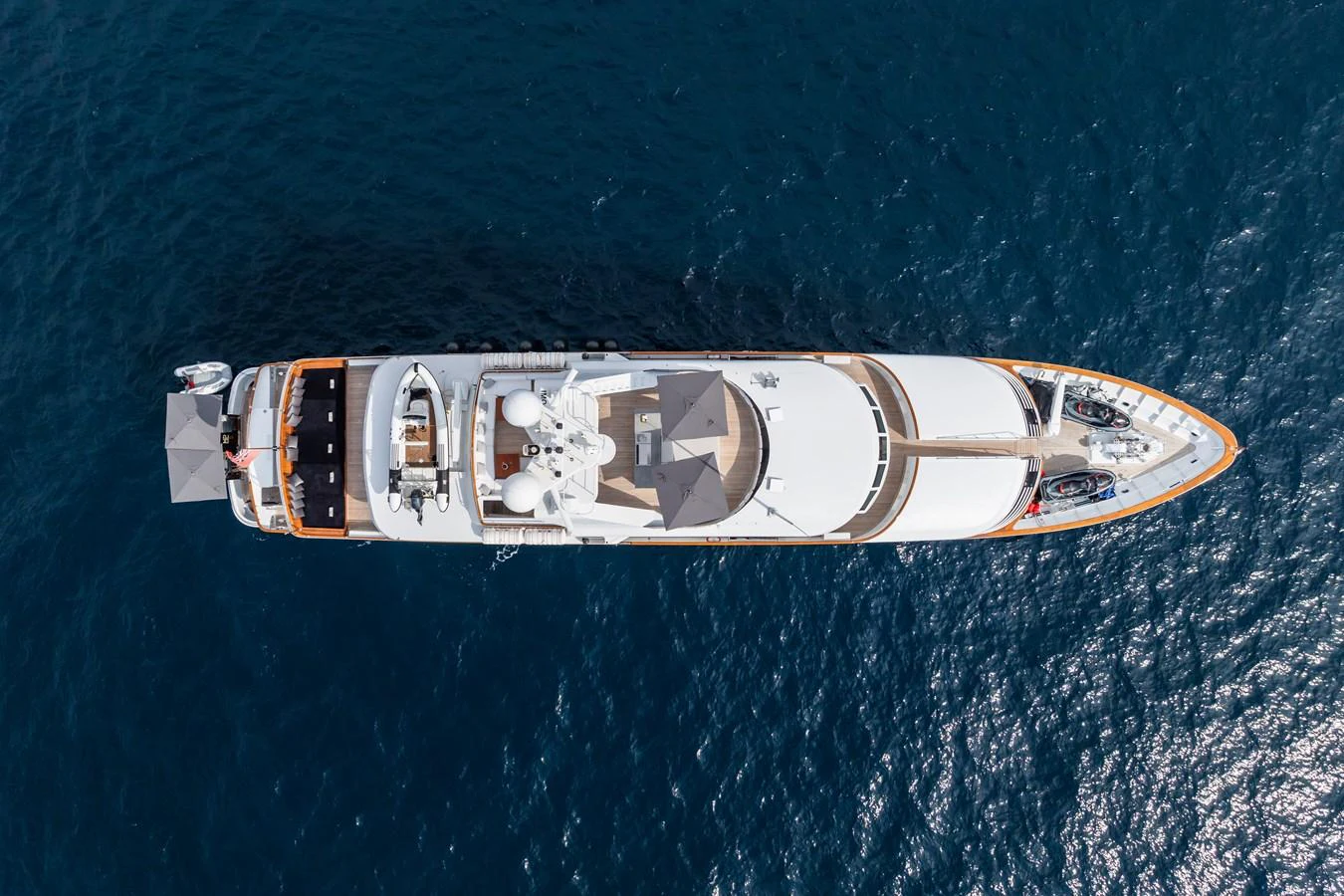 A stunning aerial view of a luxurious yacht gracefully cruising on the open sea. aboard MP5 Yacht for Sale
