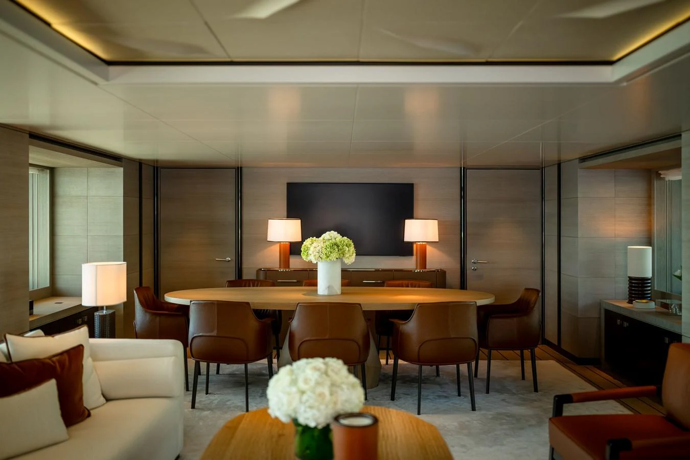 The yacht's dining area exudes elegance with its modern furnishings and warm lighting. aboard GRACE Yacht for Sale