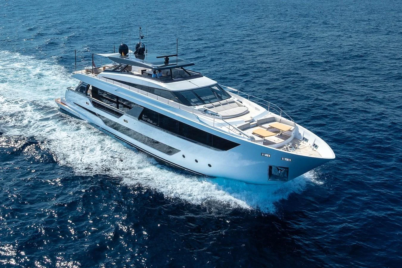 A sleek and modern yacht cruises through the open sea, showcasing its luxurious design and spacious decks. aboard FREYA Yacht for Sale