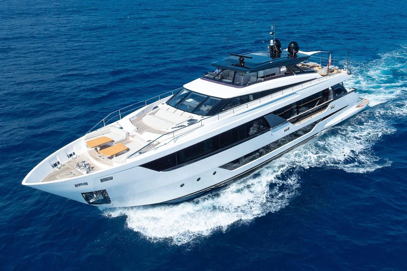 A sleek and modern yacht cruises through the deep blue sea, showcasing its luxurious design and spacious decks. aboard FREYA Yacht for Sale