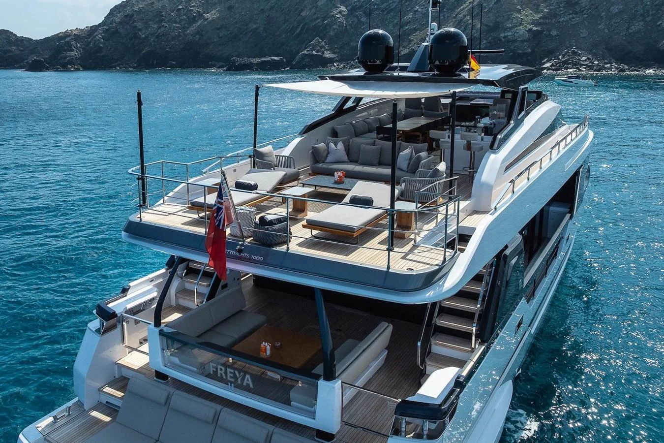 The yacht's aft deck offers luxurious seating and lounging areas with a stunning view of the surrounding waters. aboard FREYA Yacht for Sale