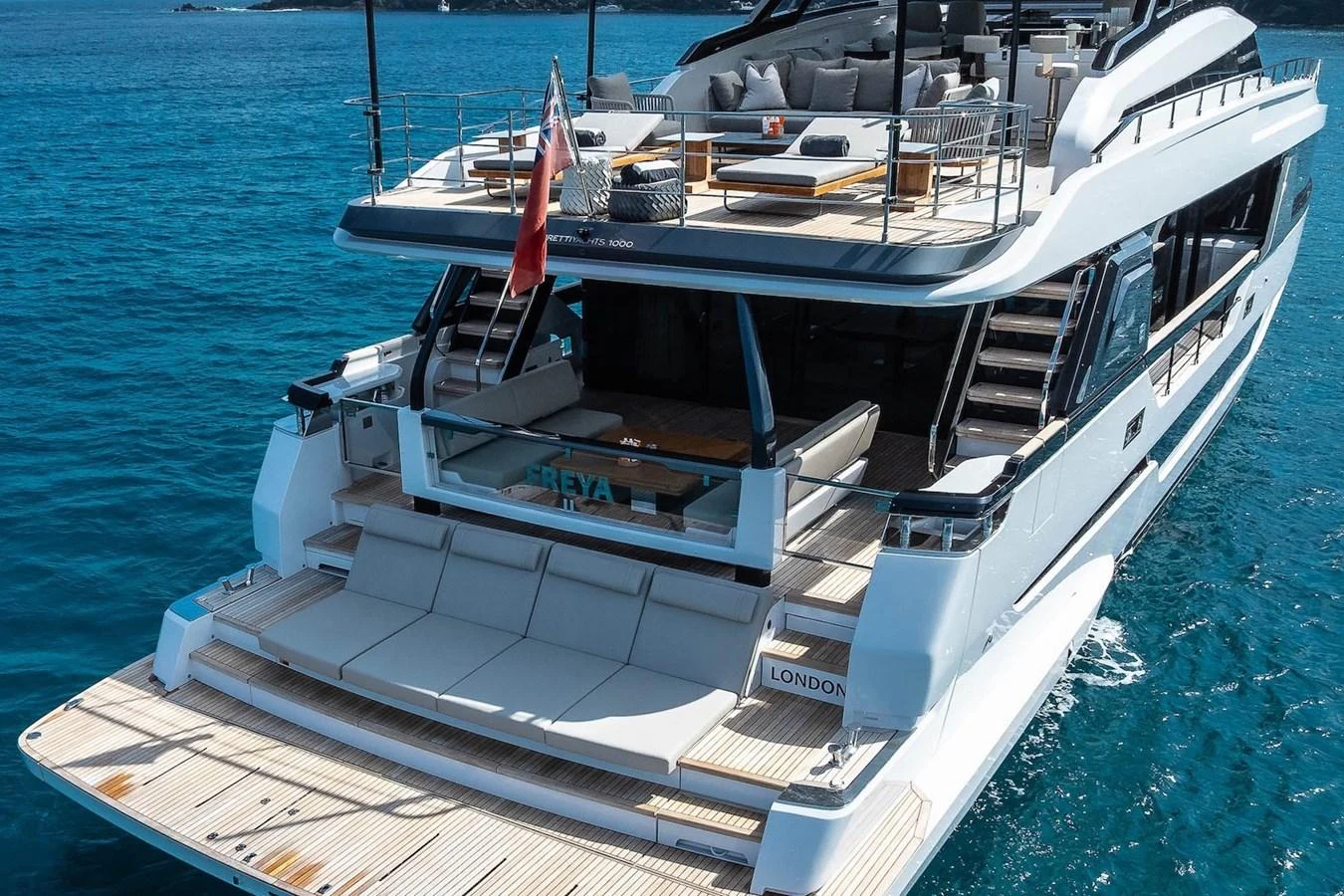 The yacht's aft deck offers luxurious lounging areas with a stunning view of the surrounding waters. aboard FREYA Yacht for Sale