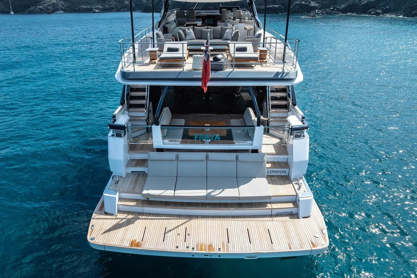 The yacht's aft deck features a spacious swim platform and inviting lounging area, perfect for enjoying the sea. aboard FREYA Yacht for Sale