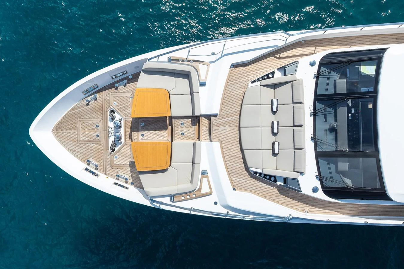 The foredeck of the yacht features luxurious sun pads and seating areas with a stunning view of the ocean. aboard FREYA Yacht for Sale
