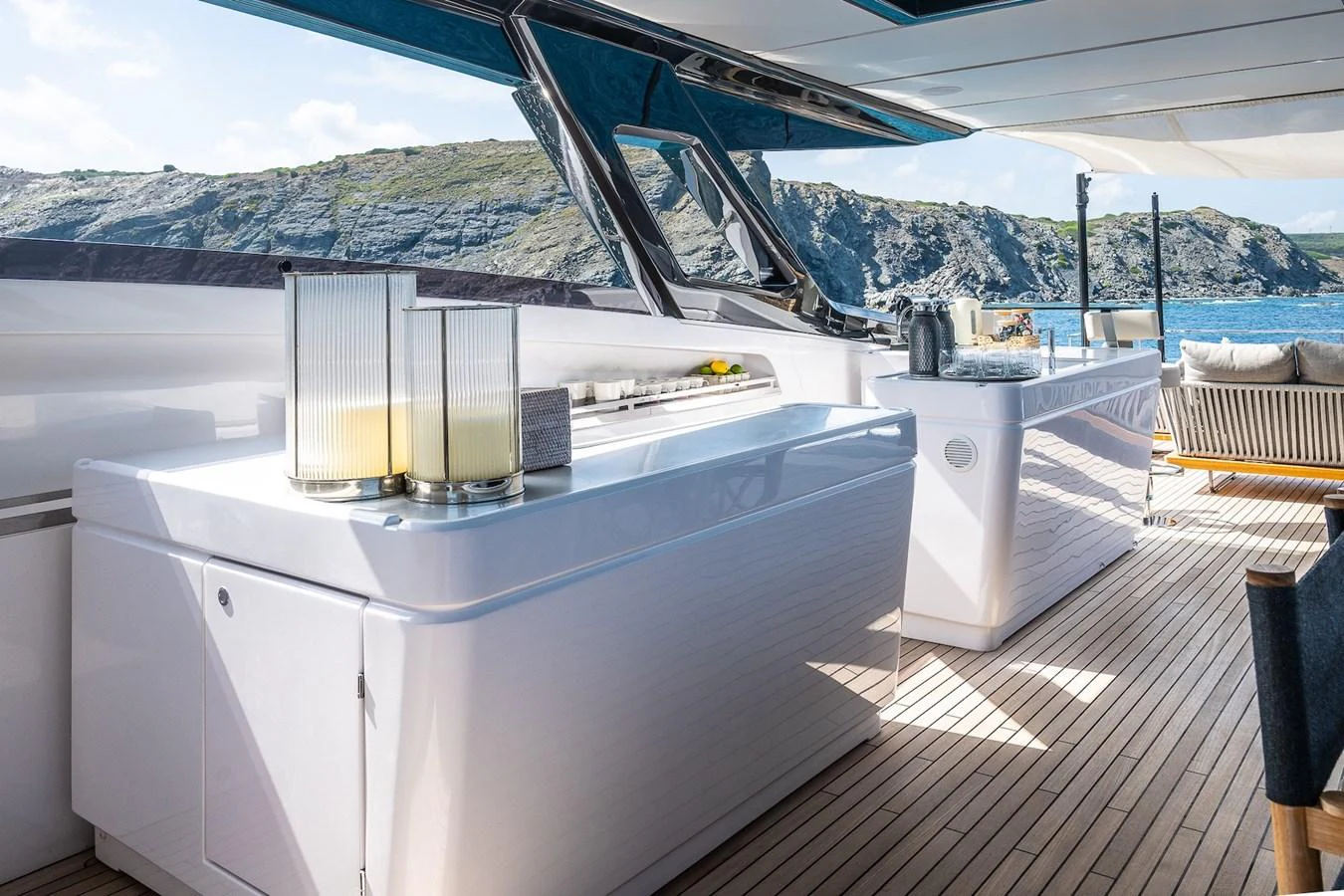 The aft deck features a sleek bar area with a scenic ocean view. aboard FREYA Yacht for Sale