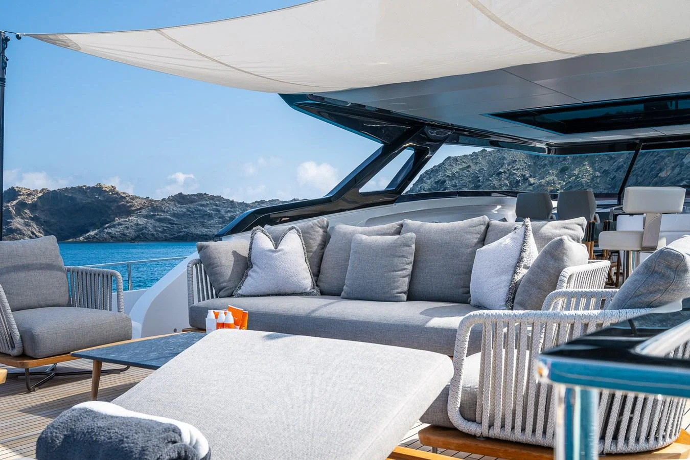The flybridge offers a luxurious outdoor lounging area with plush seating and stunning views. aboard FREYA Yacht for Sale