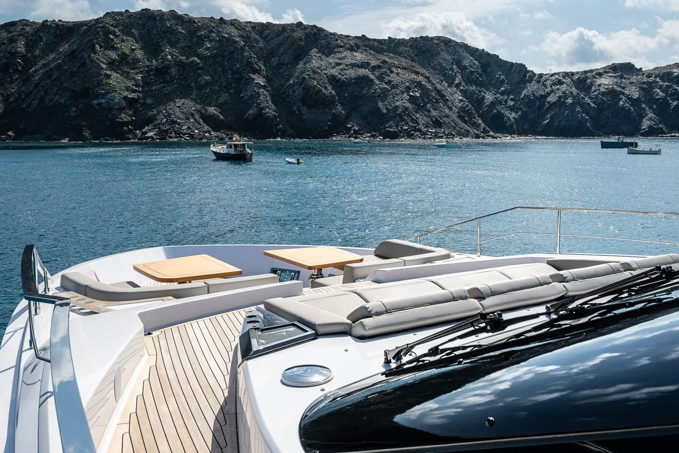 The foredeck offers a luxurious sunbathing area with stunning views of the surrounding waters and rocky coastline. aboard FREYA Yacht for Sale