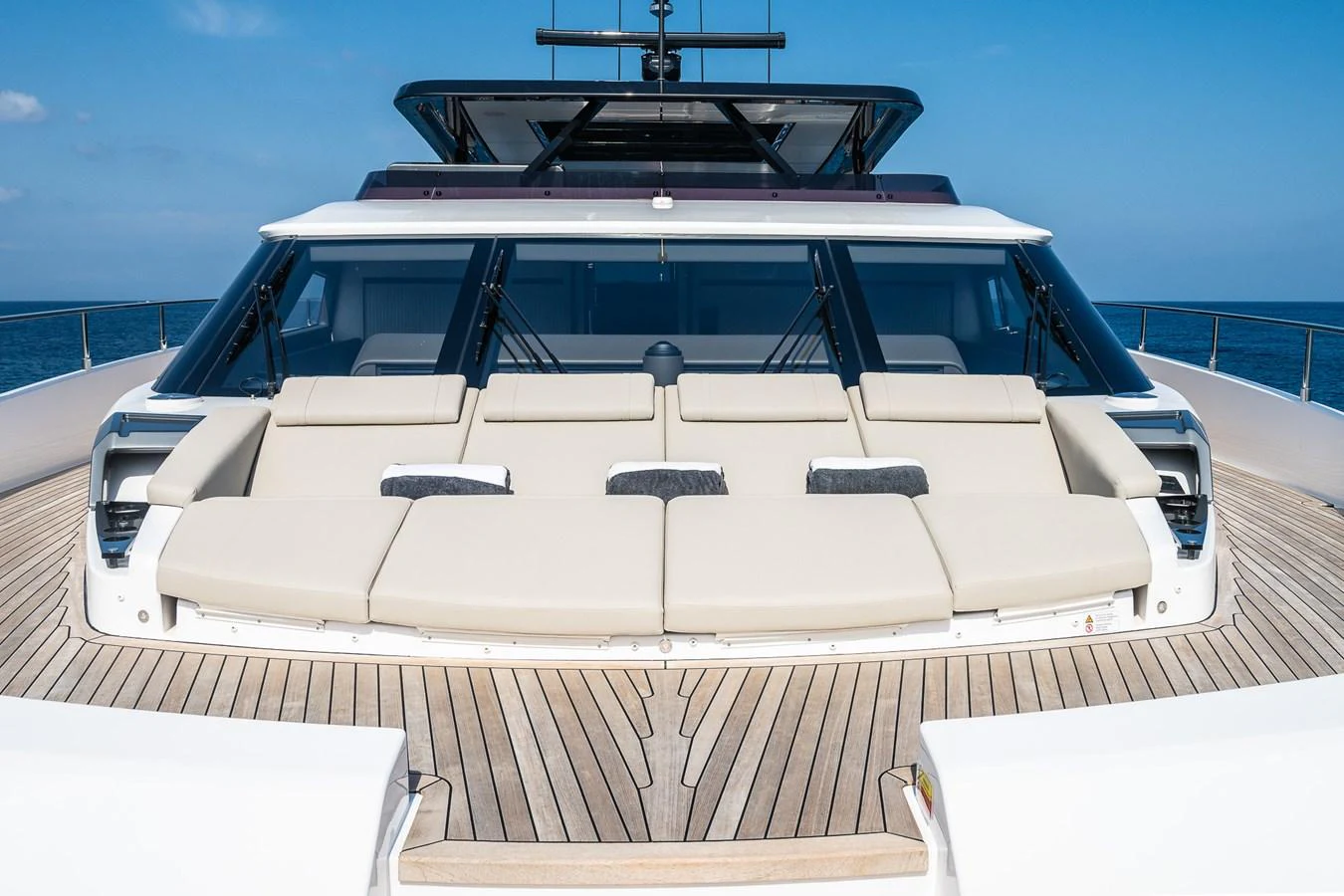 The yacht's foredeck features a spacious sunbathing area with plush cushions and a sleek design. aboard FREYA Yacht for Sale