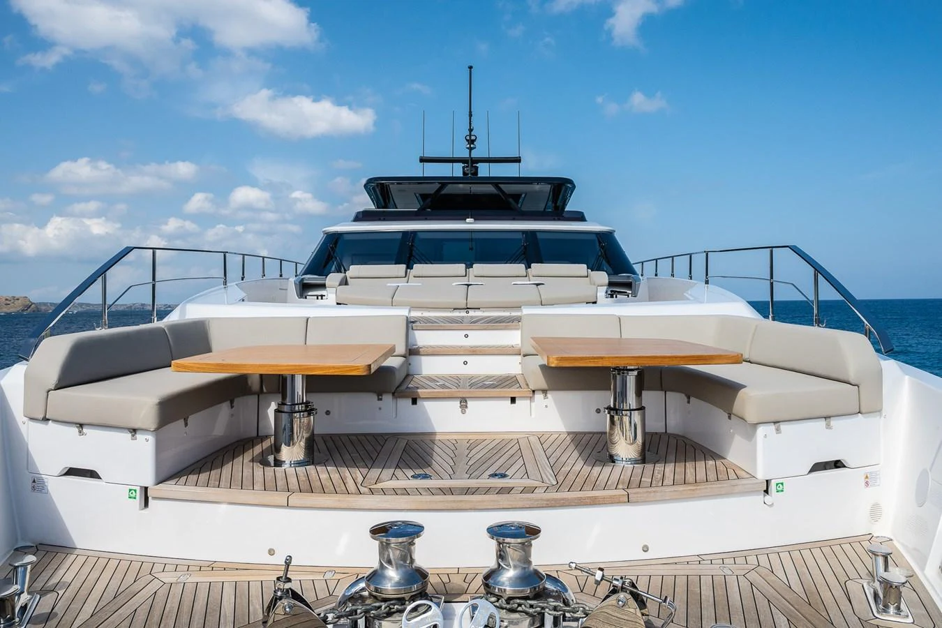 The aft deck features spacious seating and dining areas with a stunning view of the sea. aboard FREYA Yacht for Sale