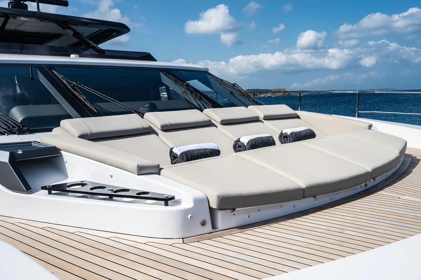 The foredeck features luxurious sun pads with a stunning ocean backdrop. aboard FREYA Yacht for Sale