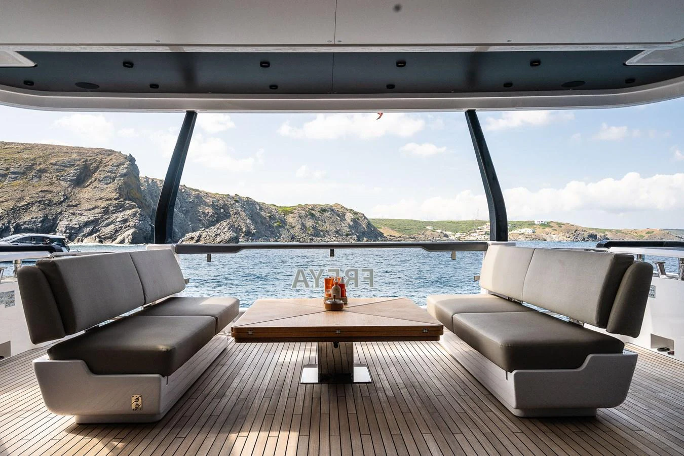 The aft deck offers a spacious and comfortable seating area with stunning views of the surrounding waters. aboard FREYA Yacht for Sale